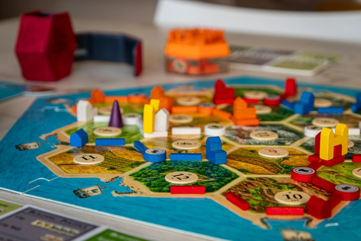 Colorful board game pieces arranged on a tabletop