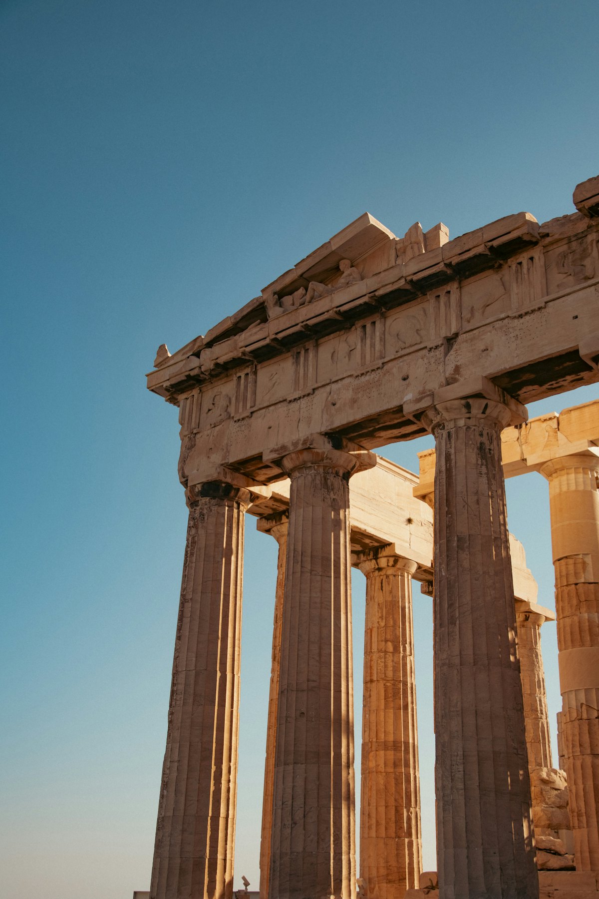 Ancient Greek temple columns in sunlight